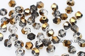 CBI637 Crystal Old Gold Bi-cone  x 25