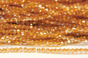 2mm Sand Lustre Deep Champagne Crystal Bicones