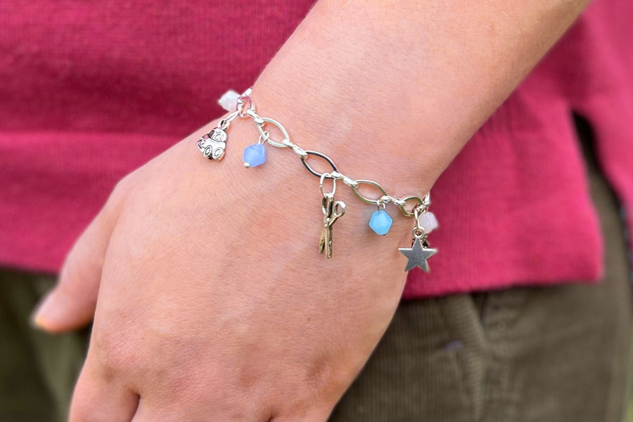 blue-charm-bracelet-on-maxine